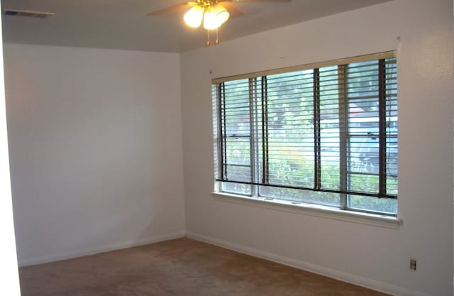 carpeted empty room with ceiling fan