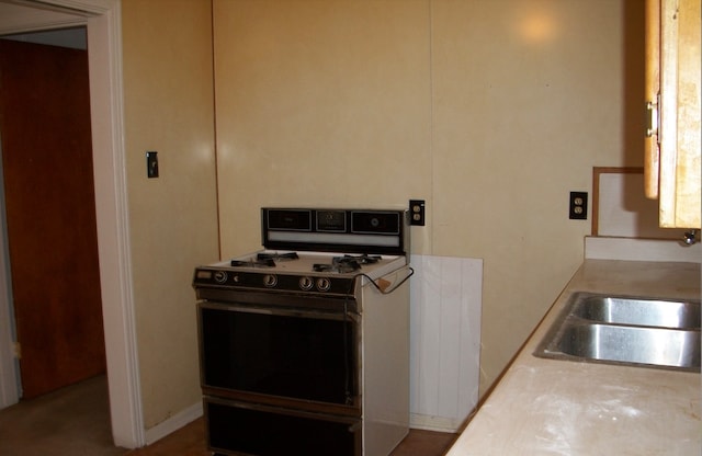 kitchen with stove and sink