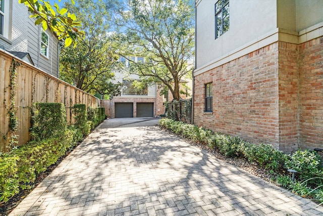 exterior space with an outbuilding and a garage