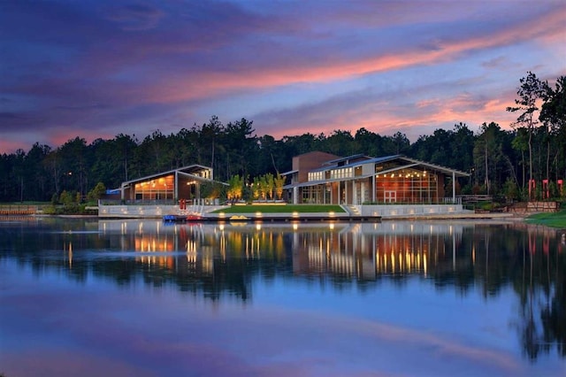 property view of water with a forest view