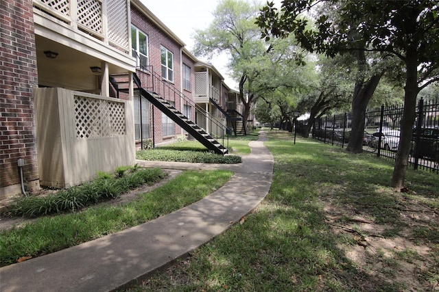 view of home's community featuring a lawn