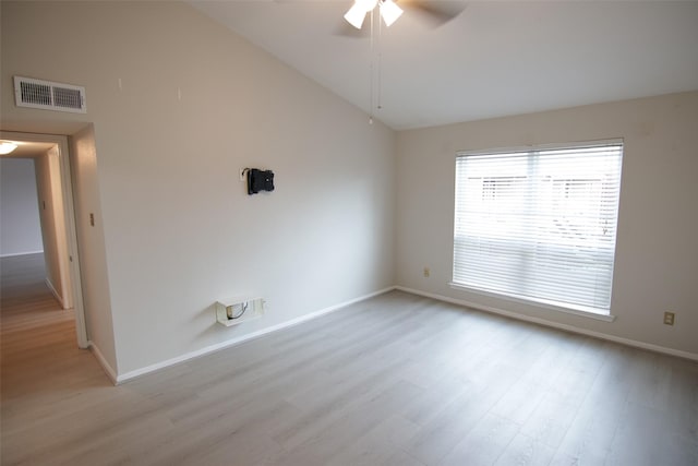 spare room with ceiling fan, light hardwood / wood-style flooring, and high vaulted ceiling