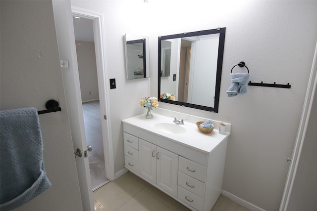 bathroom featuring tile patterned flooring and vanity