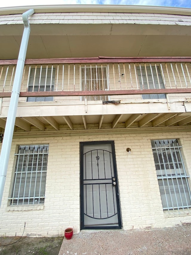 doorway to property featuring a balcony