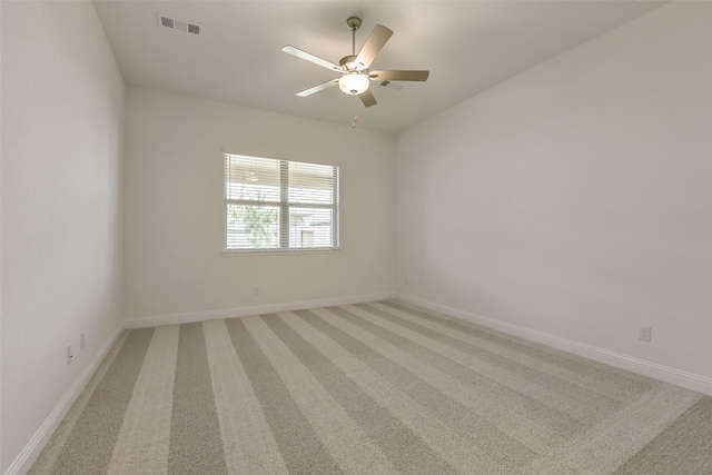 16334 Placid Stream St, Conroe, TX 77302 - spare room with baseboards, visible vents, a ceiling fan, and light colored carpet