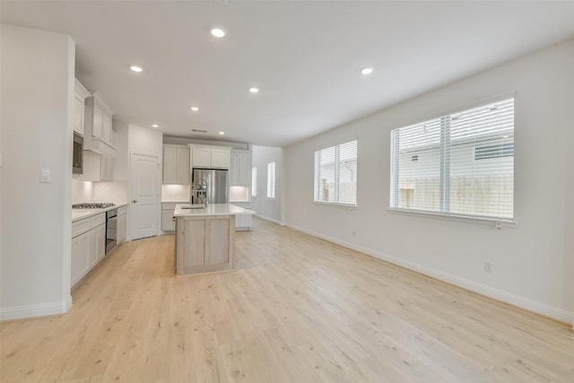 16334 Placid Stream St, Conroe, TX 77302 - kitchen featuring baseboards, stainless steel appliances, and light countertops