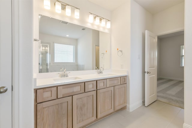 16334 Placid Stream St, Conroe, TX 77302 - full bathroom with a shower with shower door, visible vents, and a sink