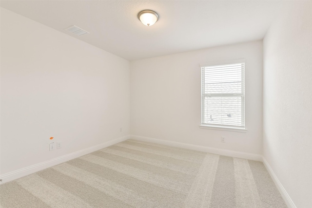 16334 Placid Stream St, Conroe, TX 77302 - spare room featuring light colored carpet, baseboards, and visible vents
