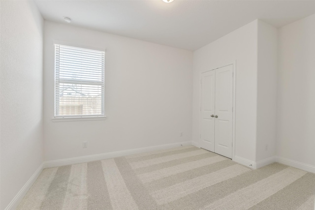 16334 Placid Stream St, Conroe, TX 77302 - empty room featuring light colored carpet and baseboards
