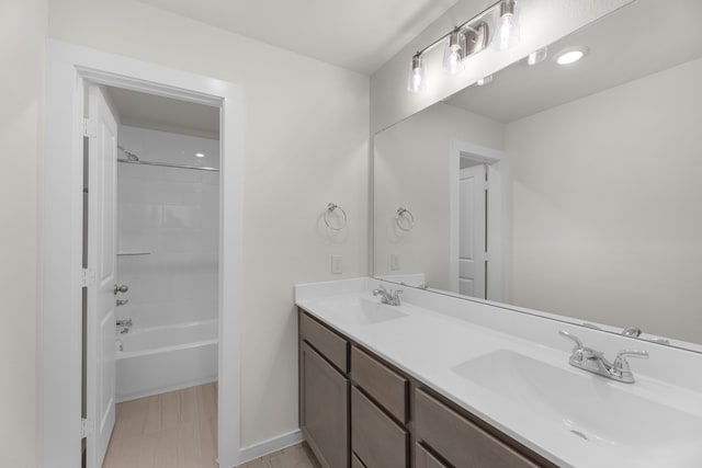 bathroom with shower / tub combination and vanity