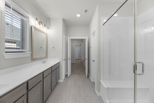 bathroom with vanity and walk in shower