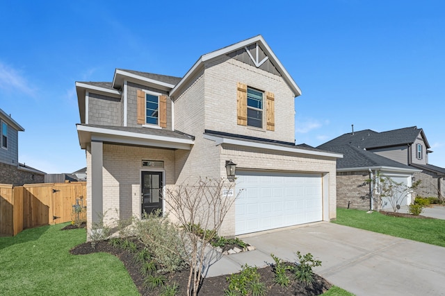 view of front of property with a garage and a front lawn