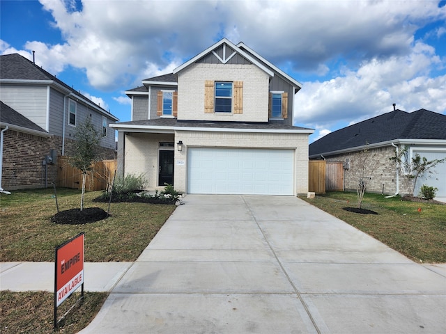 front facade featuring a front yard and a garage