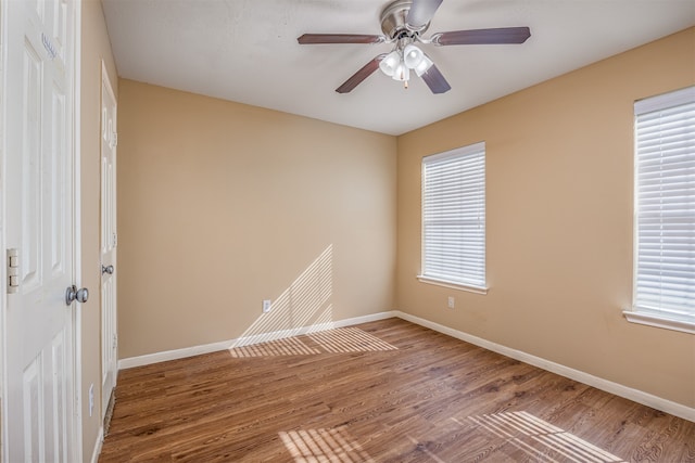 spare room featuring ceiling fan and wood-type flooring