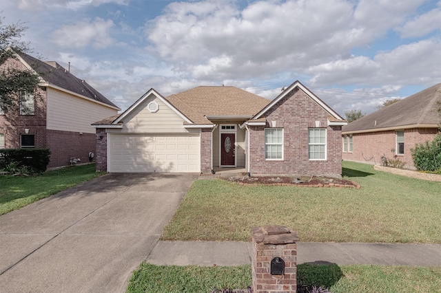 view of front of home with a front lawn and a garage