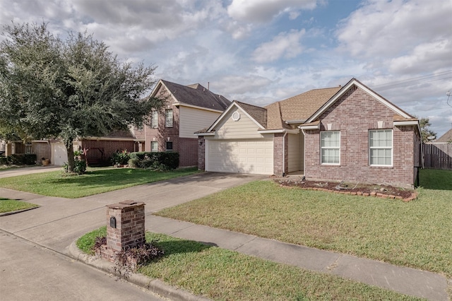 view of front of property featuring a garage and a front lawn