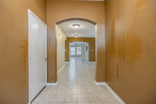 hallway featuring light tile patterned floors