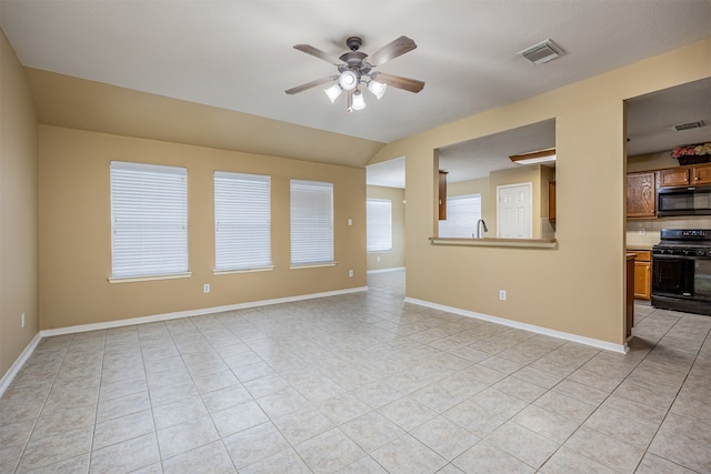 unfurnished living room with light tile patterned floors and ceiling fan