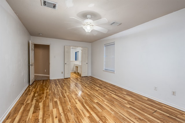 unfurnished bedroom featuring ceiling fan and light wood-type flooring