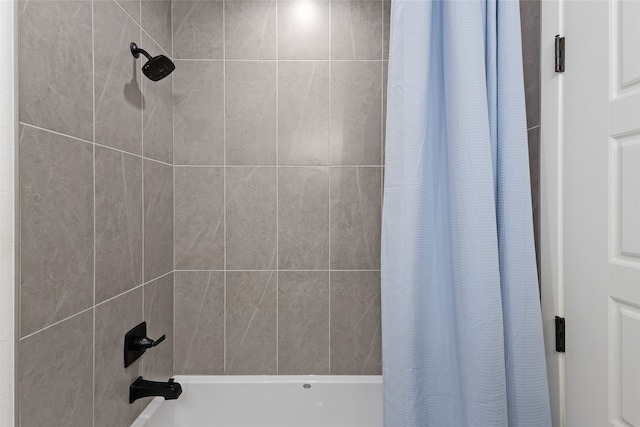 bathroom with shower / bath combination with curtain