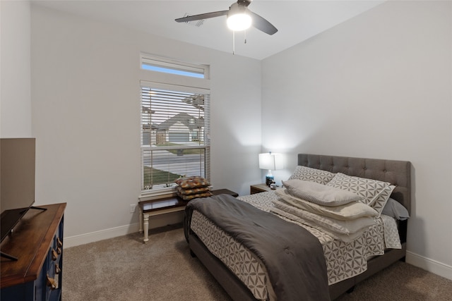 carpeted bedroom with multiple windows and ceiling fan