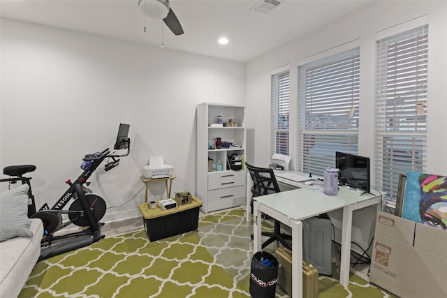 office space featuring ceiling fan and light wood-type flooring