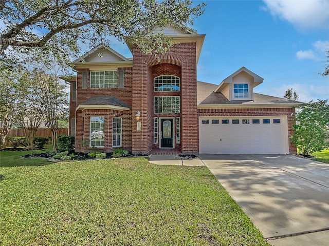 front of property featuring a garage and a front lawn