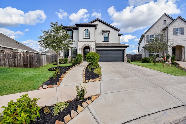 view of front of home featuring a garage and a front lawn