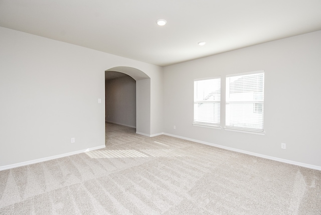 empty room featuring light carpet