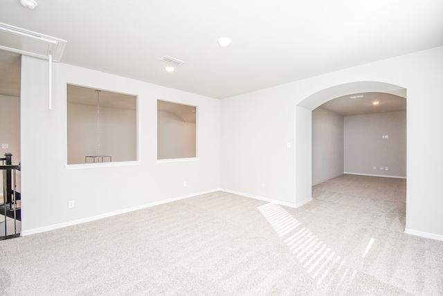 spare room with light colored carpet