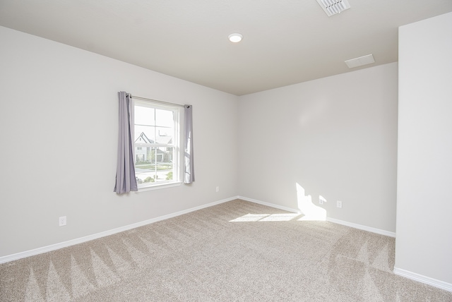 empty room with light colored carpet