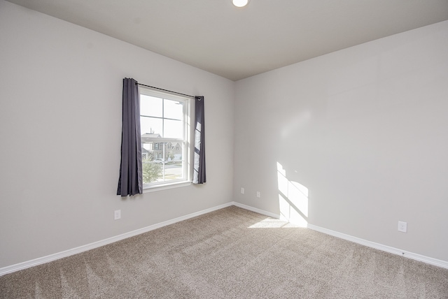 unfurnished room featuring carpet floors