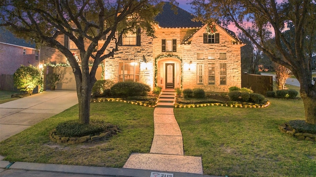 view of front of home with a lawn