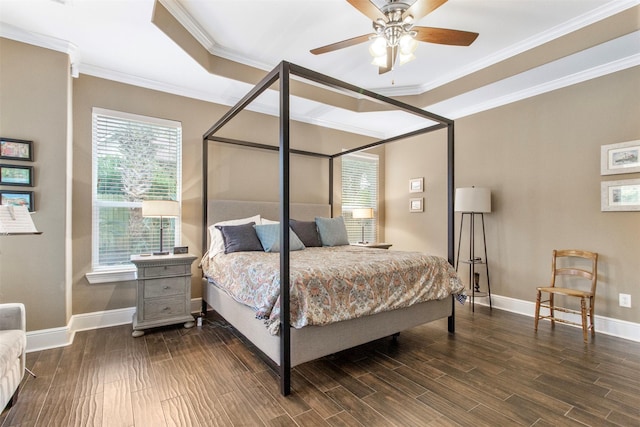 bedroom featuring hardwood / wood-style flooring, ceiling fan, and crown molding