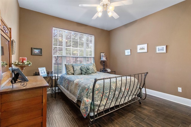 bedroom featuring ceiling fan and dark hardwood / wood-style flooring