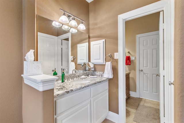 bathroom featuring vanity and tile patterned flooring