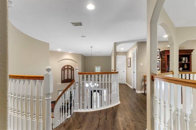 hall with dark hardwood / wood-style flooring