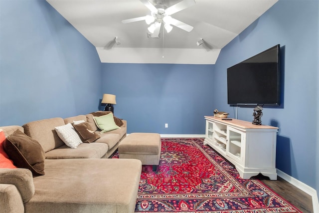 living room featuring ceiling fan, lofted ceiling, and hardwood / wood-style flooring