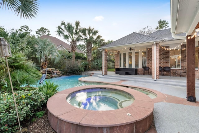 view of pool with an outdoor hangout area, a patio area, ceiling fan, and an in ground hot tub