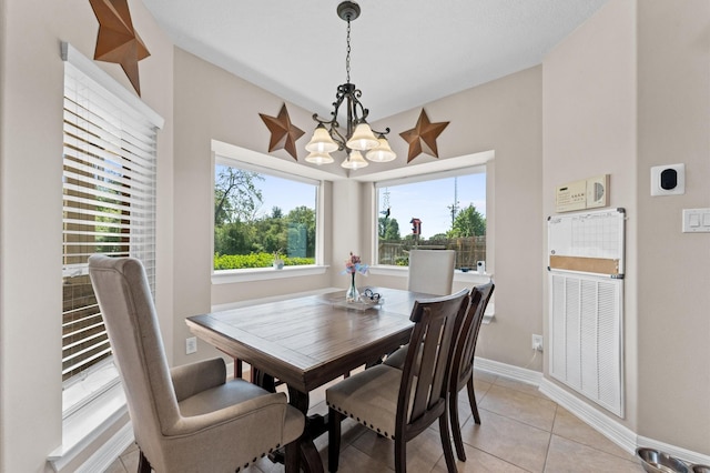 5960HIGHWAY 36 N, Bellville, TX 77418 - dining space featuring baseboards, a notable chandelier, and light tile patterned floors
