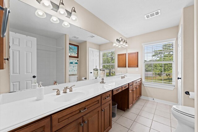 5960HIGHWAY 36 N, Bellville, TX 77418 - full bathroom with tile patterned floors, a sink, baseboards, toilet, and visible vents
