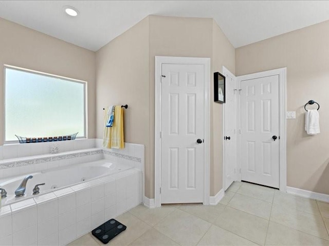 5960HIGHWAY 36 N, Bellville, TX 77418 - bathroom with baseboards, tile patterned flooring, and a tub with jets