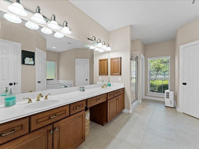 5960HIGHWAY 36 N, Bellville, TX 77418 - bathroom with a sink, a stall shower, double vanity, baseboards, and tile patterned flooring