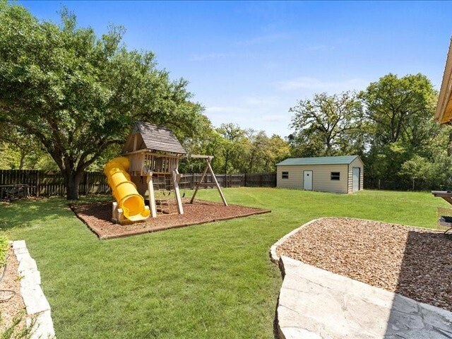 5960HIGHWAY 36 N, Bellville, TX 77418 - view of play area featuring a fenced backyard, an outdoor structure, and a yard