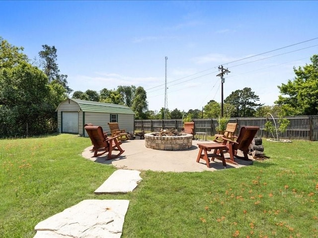 5960HIGHWAY 36 N, Bellville, TX 77418 - view of yard featuring an outbuilding, a fenced backyard, a fire pit, a garage, and a patio area