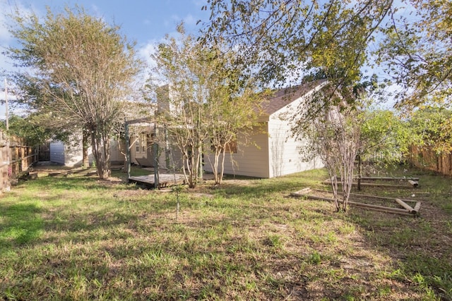 view of yard with a wooden deck