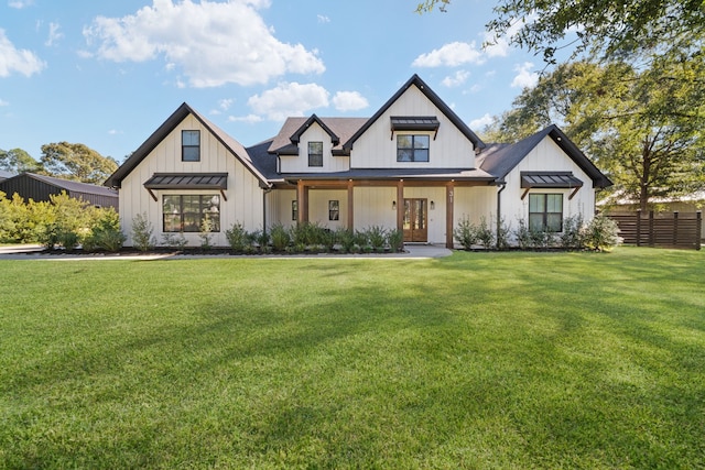 modern farmhouse featuring a front yard