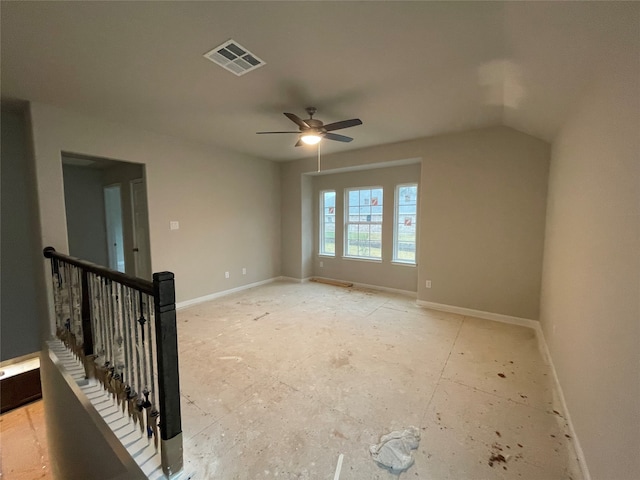 unfurnished room featuring lofted ceiling and ceiling fan