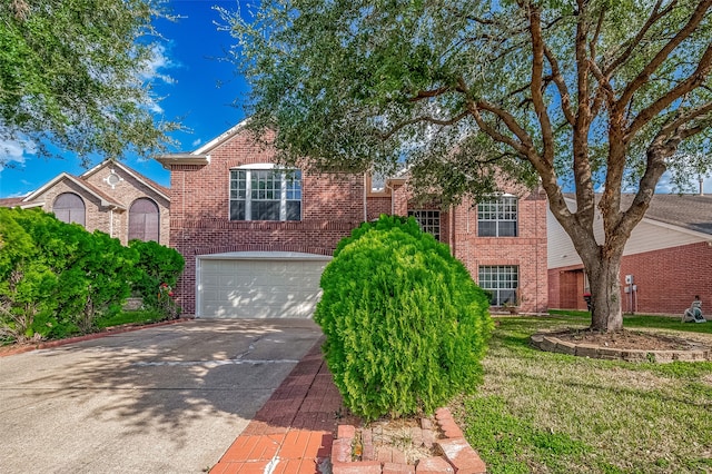 view of front of property featuring a garage and a front lawn