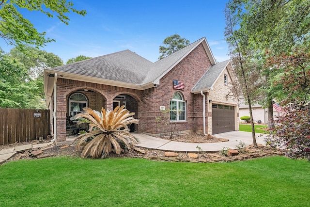 view of front facade featuring a front yard and a garage